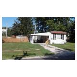 HOUSE TRAILER W/CARPORT & UTILITY SHED ON LOT