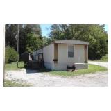 HOUSE TRAILER W/UTILITY SHED ON LOT