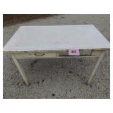 PORCELAIN TOP TABLE ON ROLLERS...48X27"