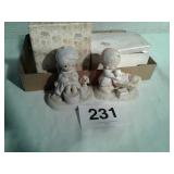 2 precious moments figurines