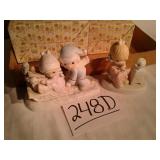 2 precious moments figurines
