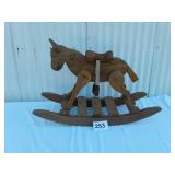 Wooden rocking horse missing stirrup