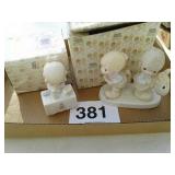 2 precious moments figurines