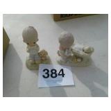 2 precious moments figurines