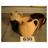 3 STONE PITCHERS, GLAZED MIDDLE PITCHER HAS