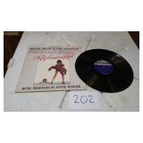 THE WOMAN IN RED RECORD