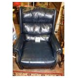 LEATHER RECLINER (RIPS ON ARMS OF CHAIR)