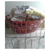LAUNDRY BASKET OF TOWELS AND SHOE RACK