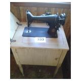 SINGER SEWING MACHINE AND CABINET