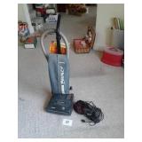 Upright Eureka vacuum and a hand-held Dirt Devil