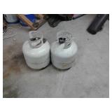 Two propane tanks one is full