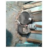 Oil drain pan used motor oil jug with oil in it