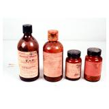 Four Antique Brown Glass Poison Bottles