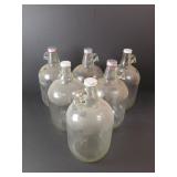 Seven 1 Gallon Glass Jugs