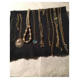 Group of 5 Gold Toned necklaces