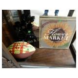 SHELF OF ASSORTED MERCHANDISE.