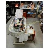 GROUP OF 2 BABY BEDS WITH CONTENTS.