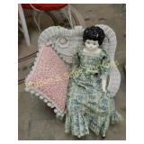 VINTAGE SMALL WICKER CHAIR WITH PORCELAIN DOLL.