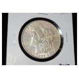 US 1900-P MORGAN SILVER DOLLAR.  AU QUALITY