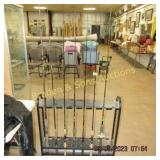 GROUP OF 7 FISHING POLES.  ONE HAS A REEL