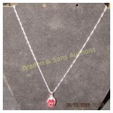 LADIES STERLING SILVER AND RUBY NECKLACE.