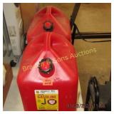 GROUYP OF 2 LIKE NEW 5 GAL GAS STANDS