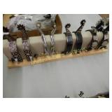 GROUP OF 4 PAIRS OF NEW WESTERN SPURS (SPUR STAND