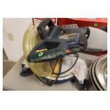 USED RYOBI 10" CHOP SAW IN WORKING ORDER.