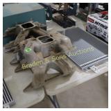 GROUP OF 4 USED EDELBROCK INTAKES AND NEW