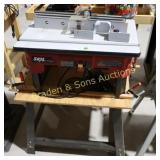 USED SKIL ROUTER WITH TABLE ON STAND IN WORKING