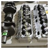 USED AUTO CRANKSHAFT AND HEADS.