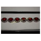 LADIES STERLING SILVER WITH RED GARNET AND TOPAZ