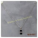 LADIES STERLING SILVER AND DARK BLUE SAPPHIRE