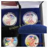 GROUP OF 4 COLORIZED SILVER EAGLES