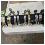 GROUP OF 4 NEW WESTERN SPURS WITH STAND