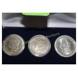 GROUP OF THREE MORGAN SILVER DOLLARS,
