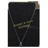 LADIES STERLING SILVER AND EMARALD NECKLACE.