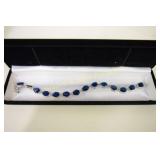 LADIES STERLING SILVER AND BLUE SAPPHIRE