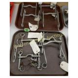 GROUP OF 4 STAR STEEL HORSE BITS AND FOUR