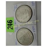 US 1885 AND 1889 MORGAN SILVER DOLLARS. AU QUALITY