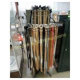 LARGE ASSOTMENT OF WESTERN BELTS WITH RACK
