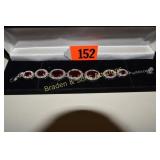 LADIES STERLING SILVER AND RED GARNET BRACELET