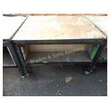 USED PORTABLE HEAVY DUTY WORK TABLE.