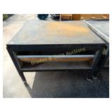 USED PORTABLE HEAVY DUTY WORK TABLE.