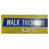 WALK THIS WAY sign