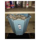 bucket of rope and sealant strip