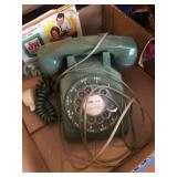Vintage dial telephone and green stamp book