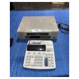 Calculator / JVC video cassette recorder