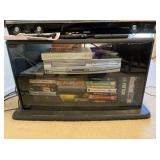 TV cabinet, vcr tapes, DVD/VCR player