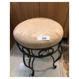 Metal stool with upholstered cushion
